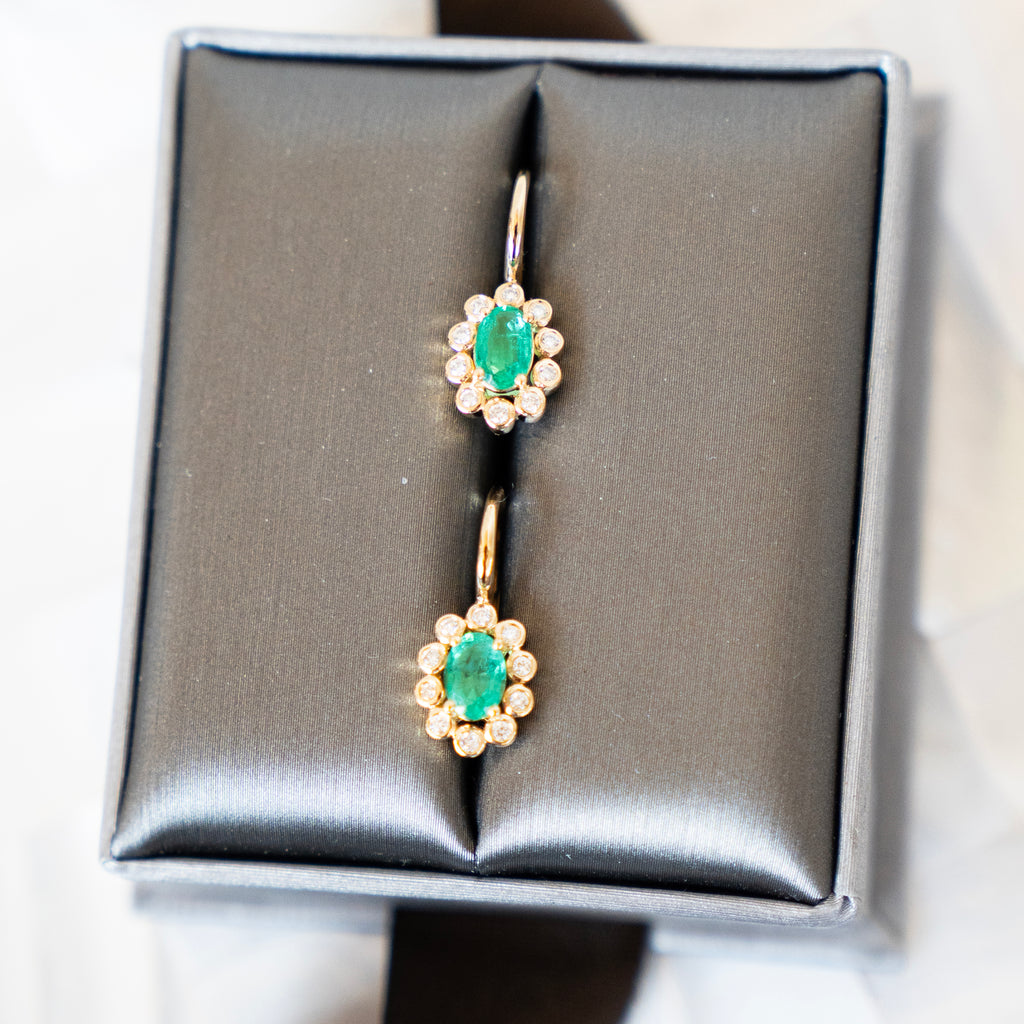 Oval Cut Emerald and Bezel Set Diamond Halo Earrings