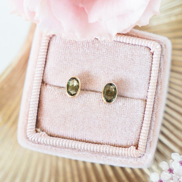 Bezel Set Oval Green Sapphire Stud Earrings in 14k Yellow Gold